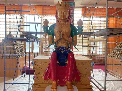 Thangka Painter Tatyana Muzraeva Works on Painting the Statue of Maitreya